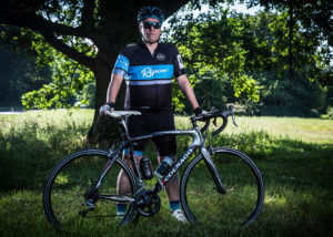 Treve Ripley standing infront of his bike