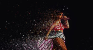 Rihanna singing on stage at Wembley