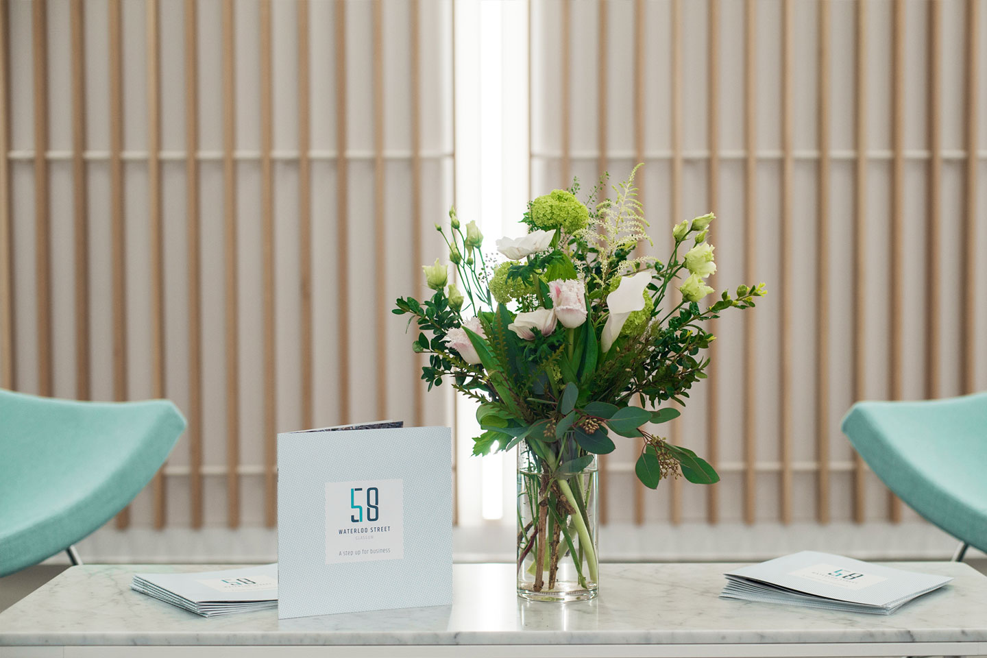 Flowers and brochure on a table at 58 Waterloo Street