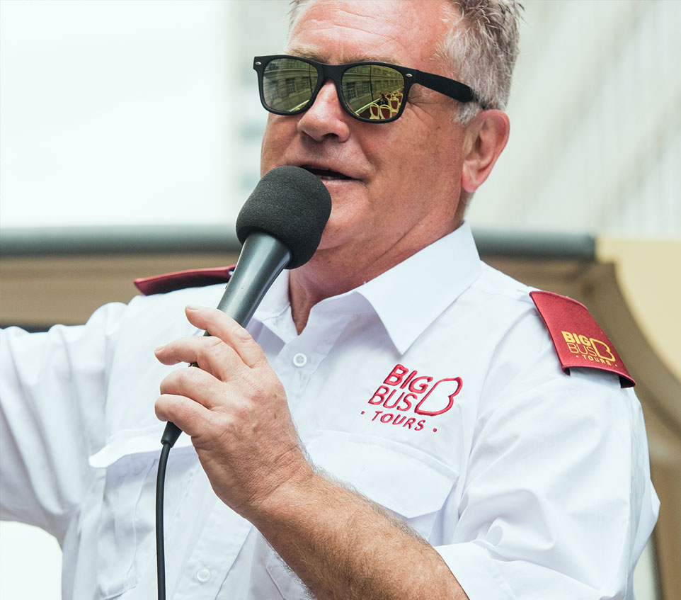 Big Bus Tour Guide talking into microphone