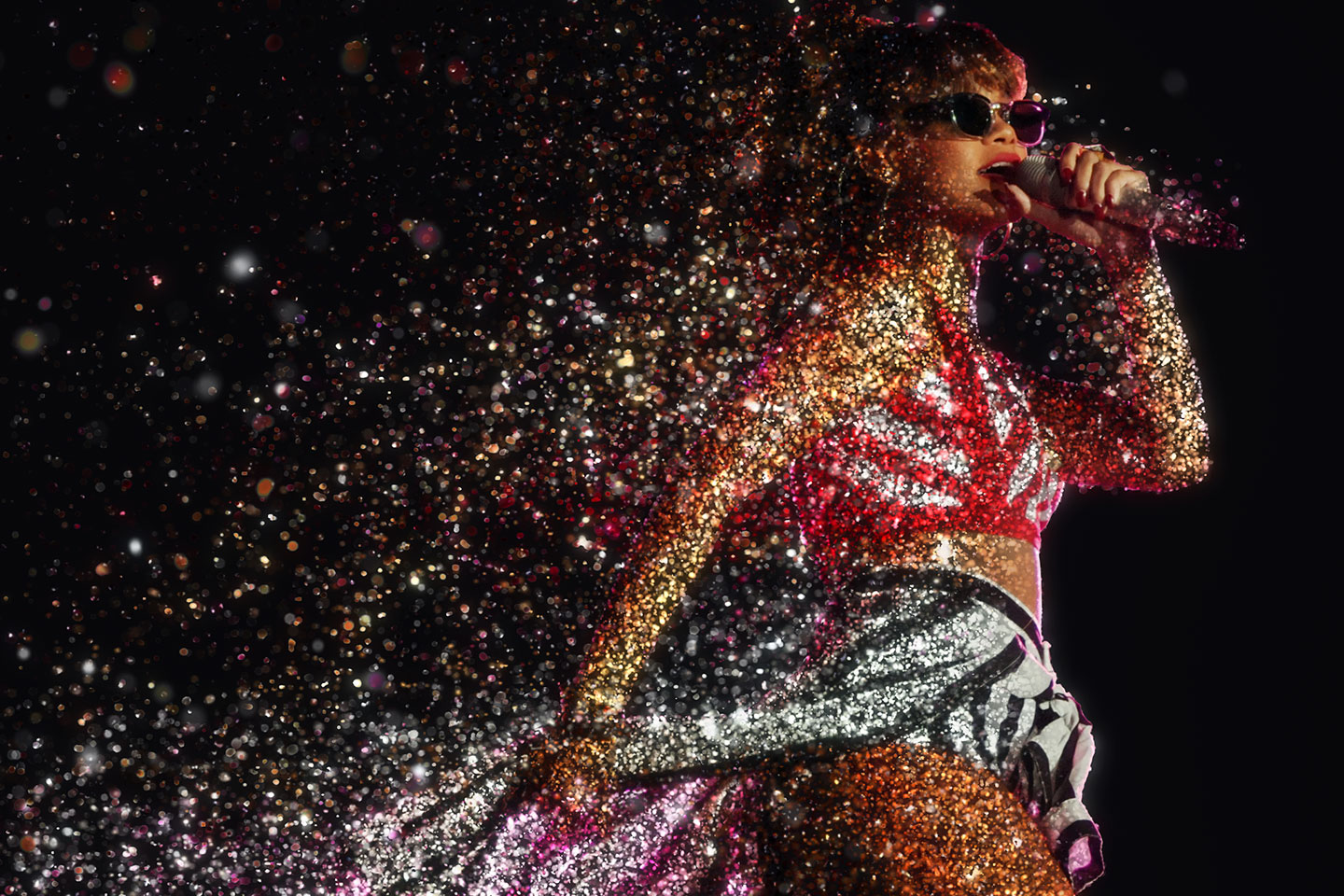 Rihanna singing on stage at Wembley