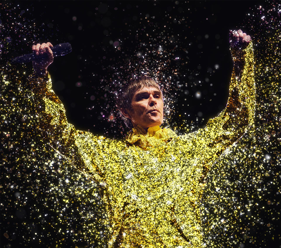 Ian Brown from Stone Roses singing on stage at Wembley