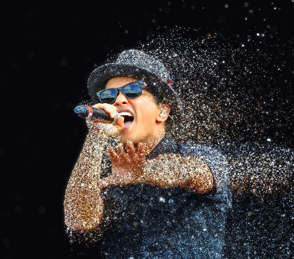 Bruno Mars singing on stage at Wembley
