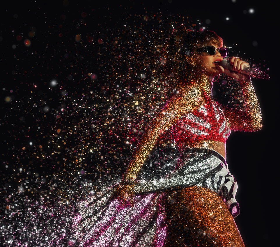 Rihanna singing on stage at Wembley