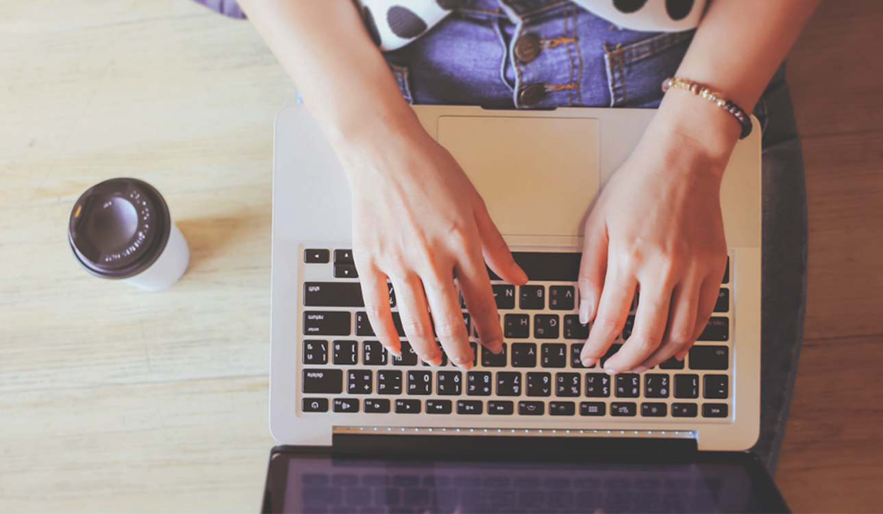 Person typing on keyboard
